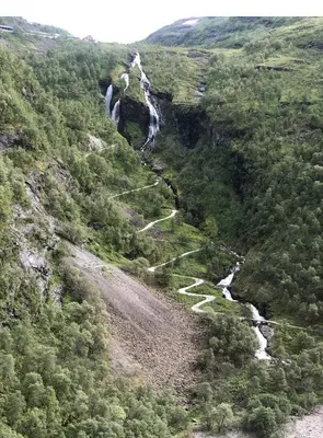 a mountain valley with a river and a waterfall at Geilo-Kikut, Ski-In, Ski-Out with Stunning Trails and Perfect Location in Geilo