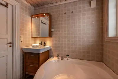 a bathroom with a large tub and a sink at Spacious detached house of 209 sqm in the heart of Geilo in Geilo