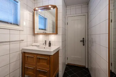 a bathroom with a sink and a mirror at Spacious detached house of 209 sqm in the heart of Geilo in Geilo