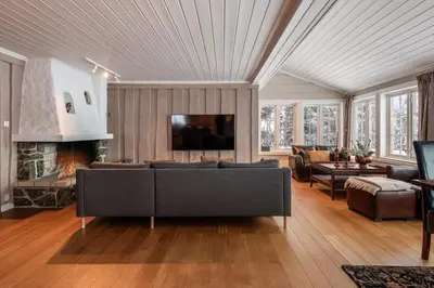 a living room with a couch and a fireplace at Spacious detached house of 209 sqm in the heart of Geilo in Geilo