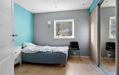 a bedroom with a bed and a window at 3 Bedroom Awesome Apartment In Nesttun in Bergen