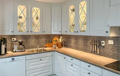 a kitchen with white cabinets and a sink at Awesome Home In Olden With Wifi in Olden