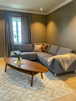 a living room with a couch and a coffee table at Villa Gulstua in Røros