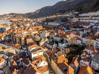 an aerial view of a city with orange roofs at Bryggen Living in Bergen
