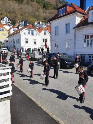 a group of children walking down a street at Fløyen Townhouse in Bergen