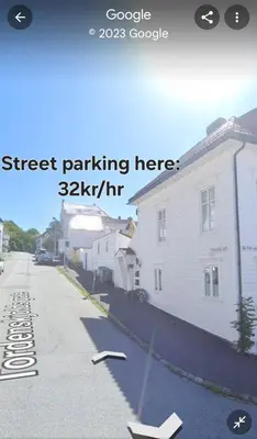 a street rendering of a street parking meter next to a house at Fløyen Townhouse in Bergen
