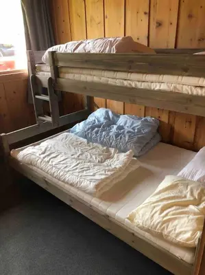 two bunk beds sitting next to each other in a room at Olden by the fjords of Norway, Bjørkelund in Stryn