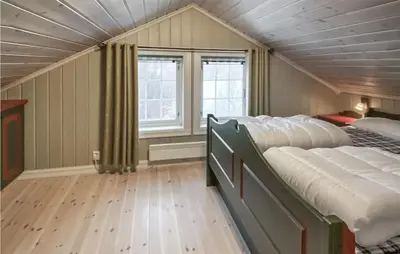 a bedroom with two twin beds in a room at Beautiful Home In Rjukan With Sauna in Rjukan