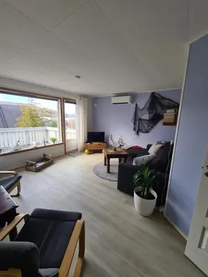 a living room with a couch and a table at Holiday Apartment in Flatanger in Vik