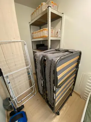 a cart with a suitcase in a room at MJOS TOWER Suite - Lovely lake view in Brumunddalen