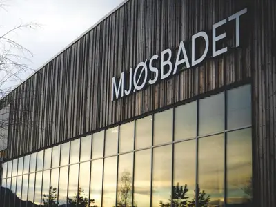 a mcedes benz building with a mcedesearcher sign on it at MJOS TOWER Suite - Lovely lake view in Brumunddalen