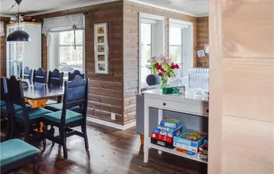 a kitchen and dining room with a table and chairs at Nice Home In Hemsedal With Sauna in Hemsedal