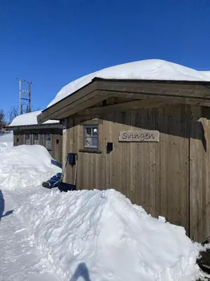 a building covered in snow with snow on top of it at New mountain lodge - Geilo-Kikut - Great location in Geilo