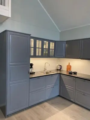 a kitchen with blue cabinets and a sink at Helt ny rorbu på Slyngstad i Ålesund Kommune in Ålesund