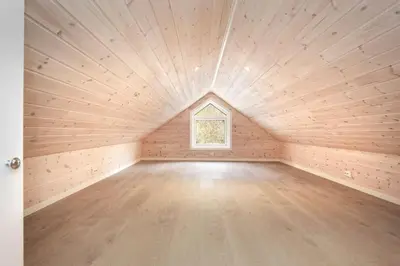 a room with a wooden floor and a window at Helt ny rorbu på Slyngstad i Ålesund Kommune in Ålesund