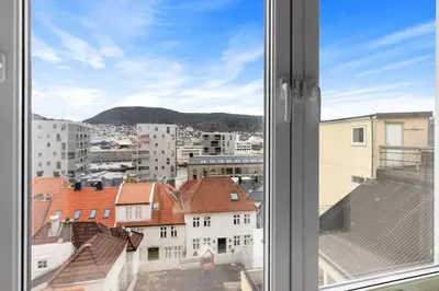a view of a city from a window at Forenom Serviced Apartments Bergen Skottegaten in Bergen