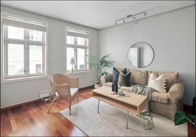 a living room with a couch and a table at Bergen city center apartment in Bergen