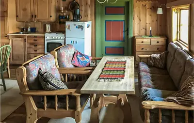 a kitchen with a table and two chairs and a couch at 2 Bedroom Stunning Home In Rauland in Rauland