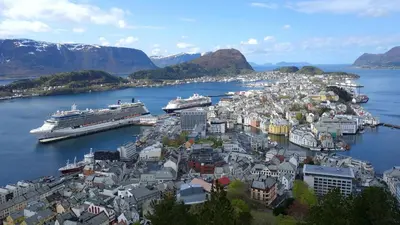 a city with a cruise ship in a harbor at Ålesund City Center - Modern 80-m2 flat with 3 bedrooms in Ålesund