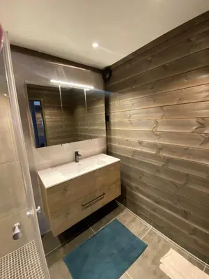 a bathroom with a sink and a mirror at Brobygget Mølla 101 in Kyrkjebøen