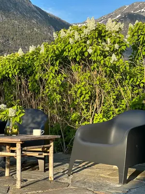 a table and a chair and a coffee table at Cozy house in Eidfjord in Eidfjord