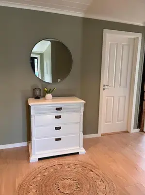 a white dresser with a mirror in a room at Cozy house in Eidfjord in Eidfjord