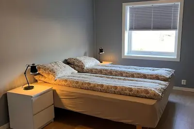 a bedroom with two beds and a window at Cozy house in Eidfjord in Eidfjord