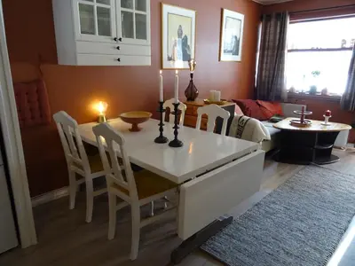 a living room with a dining room table with candles on it at Actif 106 - Hallingheim apartment ski inn/ski ut in Ål