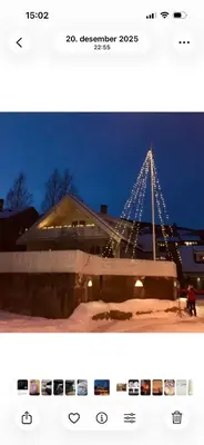 a picture of a bridge that is lit up at night at Koselig leilighet i rolig boligfelt in Gol