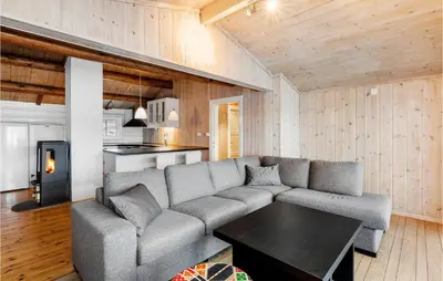 a living room with a couch and a table at Cozy Home In Meisingset With Kitchen in Meisingset