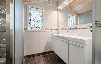 a bathroom with a sink and a mirror at Cozy Home In Meisingset With Kitchen in Meisingset