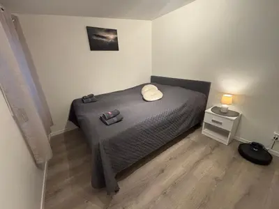 a bedroom with a bed with two pillows on it at Litle cozy apartment in Ålesund in Ålesund
