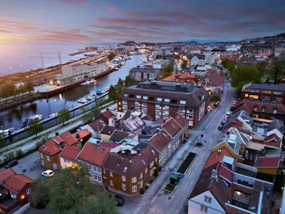an overhead view of a city with a river and buildings at Cozy backyard apartment in Trondheim