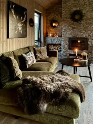 a living room with two couches and a table at Brand new cabin on the sunny side of Gaustatoppen with a beautiful view in Tuddal