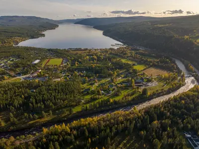 an aerial view of a town next to a lake at Øiseth Hotell AS in Rendalen