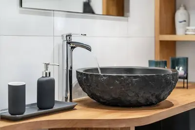 a black bowl sink on a counter in a bathroom at SKI INN/OUT - 4-room apartment w/3 bedroom in Gaustablikk