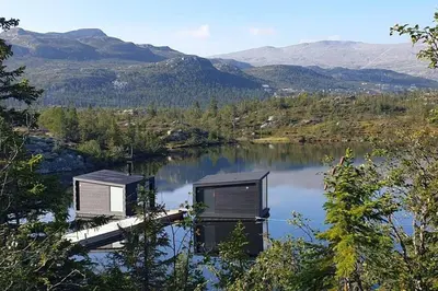 two containers sitting on a dock in a lake at SKI INN/OUT - 4-room apartment w/3 bedroom in Gaustablikk