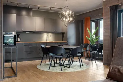 a kitchen with a table and chairs in a room at Riddertunets glimt in Beitostøl