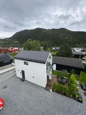 an aerial view of a white building with a patio at Chalet Orkanger - Close to Everything, Far from Ordinary in Orkanger