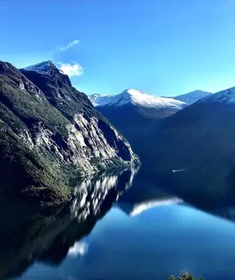 a large body of water between two mountains at Lovise Mountain Apartment in Stranda