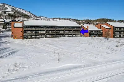 a building in the snow with a lot of snow at Geilo sentrum for 4 personer in Geilo