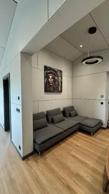 a living room with a couch in a room at Nothaugen AS in Nordheim