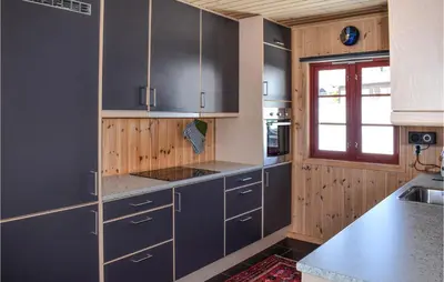 a kitchen with gray cabinets and a window at Stunning Home In Gol With Sauna in Gol